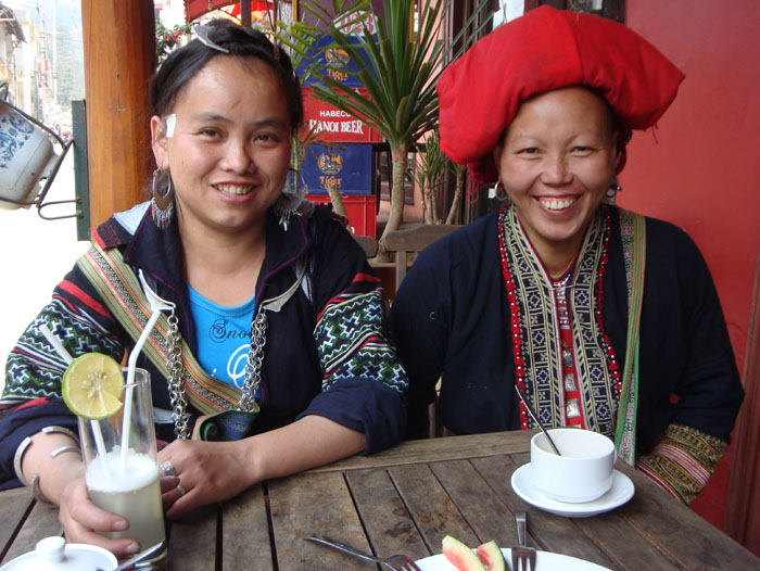 Our good friends Tea (Sho’s sister), and Ta May in their traditional Black Hmong and Red Dzao clothing.