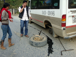 Sho, our driver, and our broken axle.