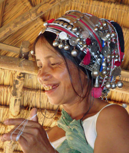 Akha woman weaving a carrying bag.
