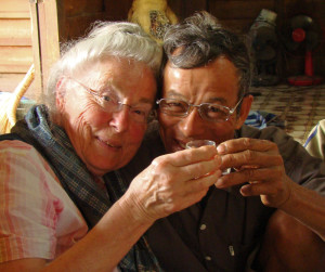 Grandma toasting a village elder in Xam Tai, Laos with Lao-Lao