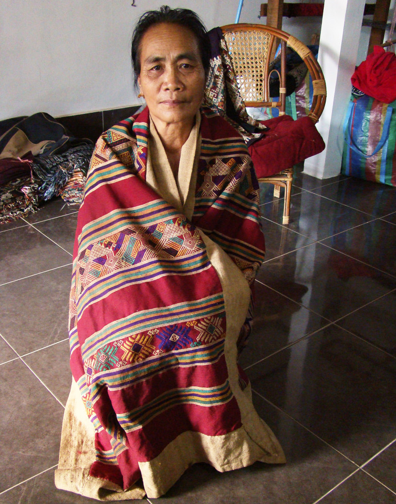 Phout's mom, Mai, wearing the cloth she wove over 50 years ago.
