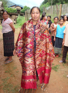 Weaver wearing her large shaman cloth.